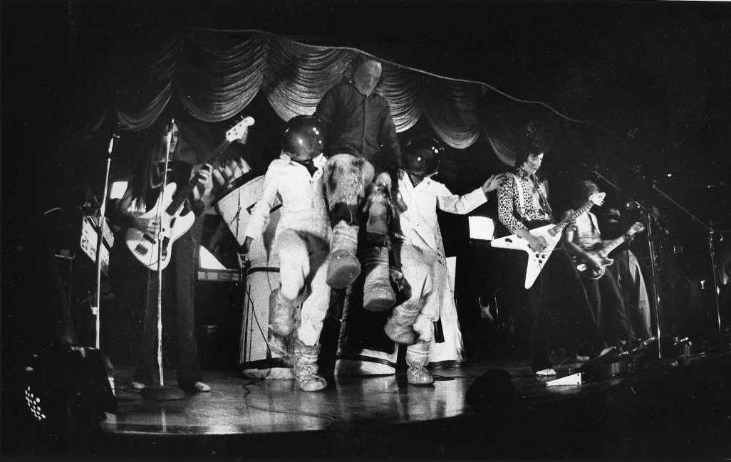 The Tubes on stage with white-suited dancers — theatrical routine