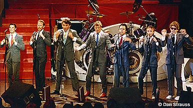 The Tubes on stage in matching suits and ties
