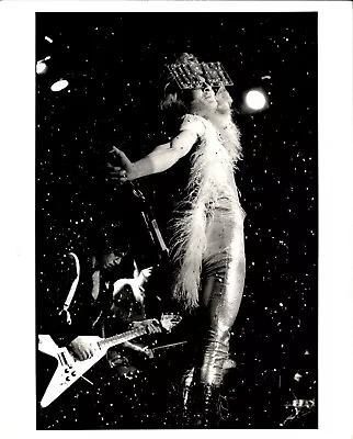 Quay Lewd with confetti, flying-V guitar in foreground